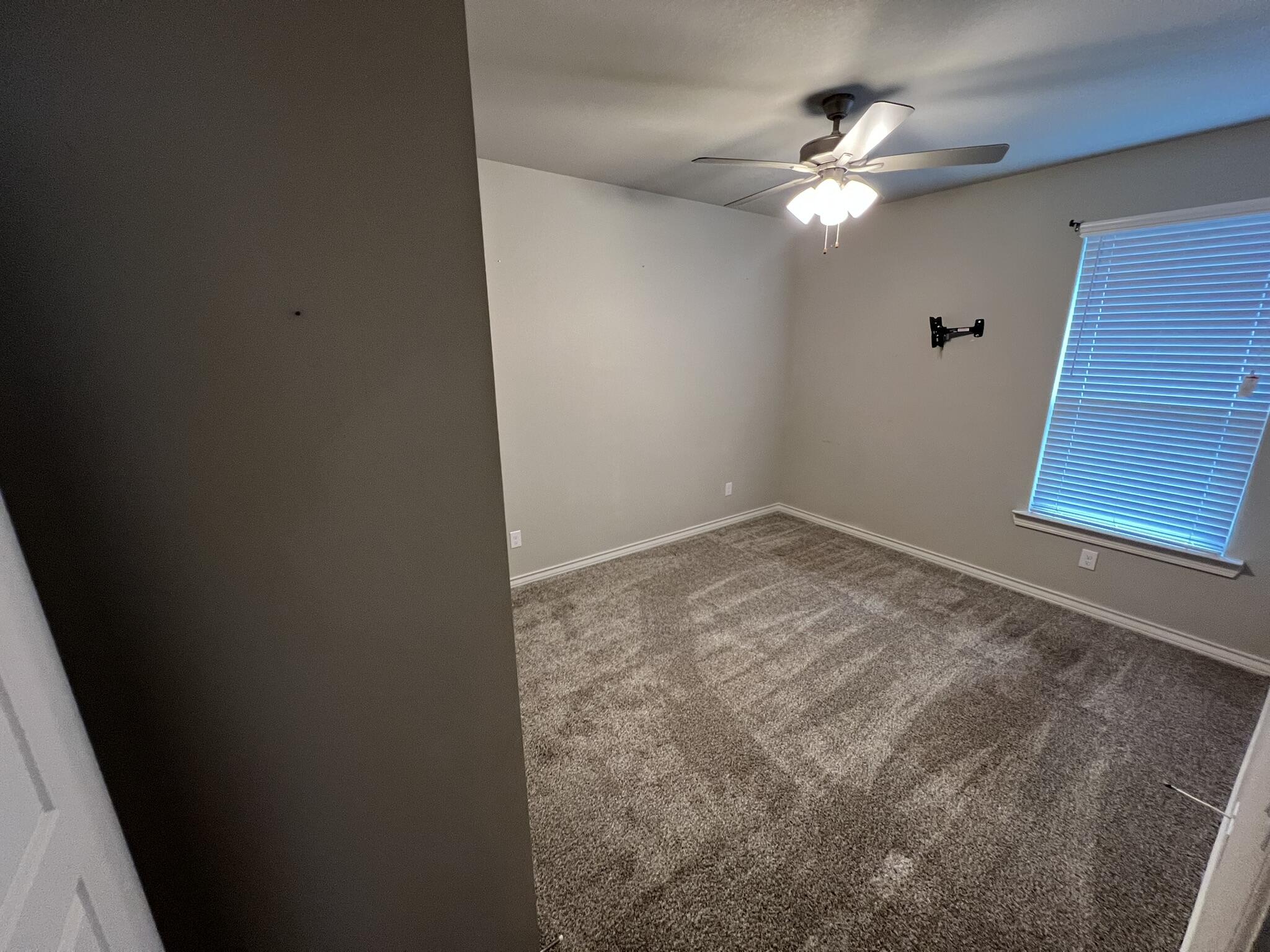 816 North 3rd Street Wolfforth, TX 79382 - Photo 16 of 28 a view of a livingroom with a fan