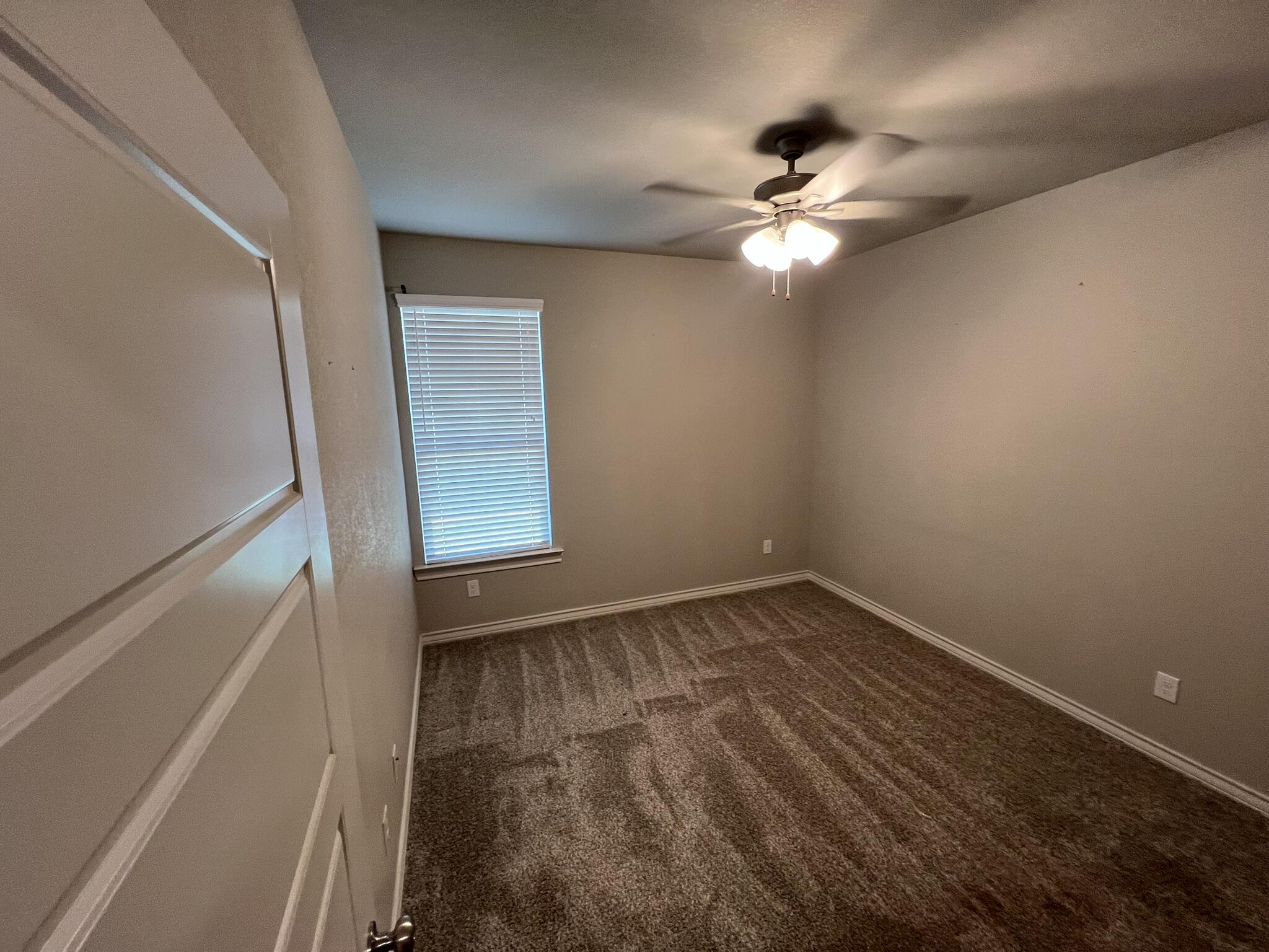 816 North 3rd Street Wolfforth, TX 79382 - Photo 22 of 28 a view of empty room with wooden floor