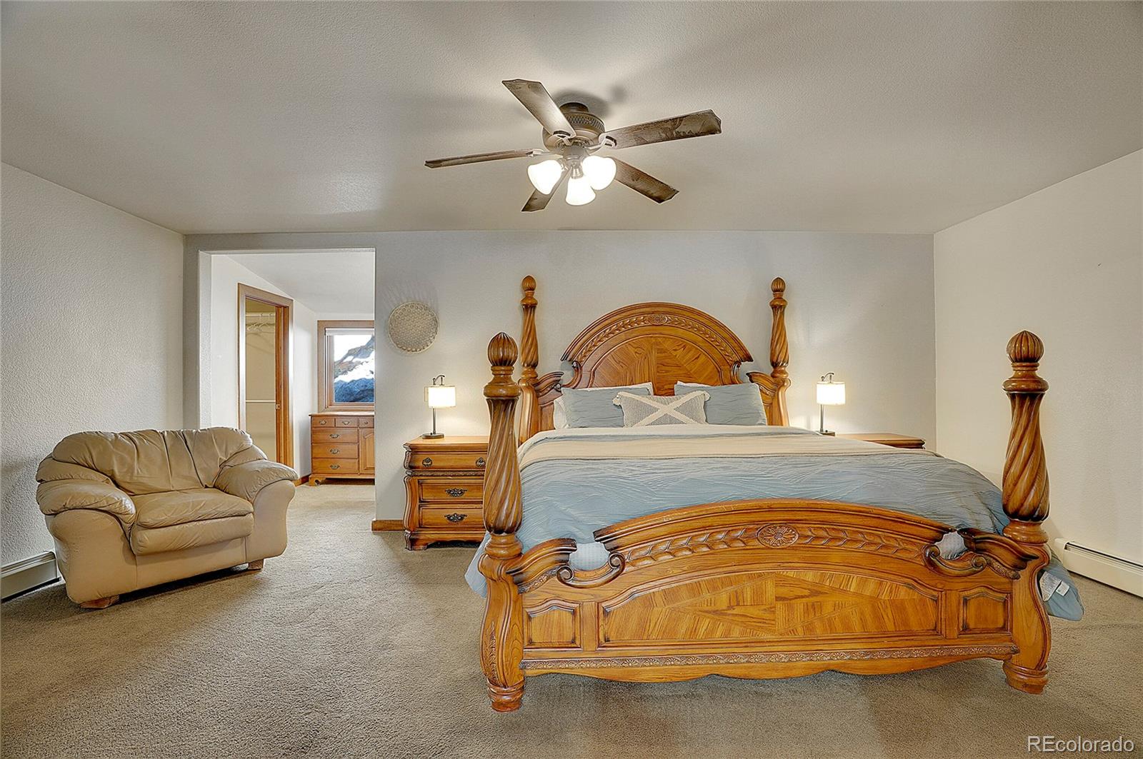 468 Riverside Drive Lyons, CO 80540 - Photo 19 of 50 a bedroom with bed and window