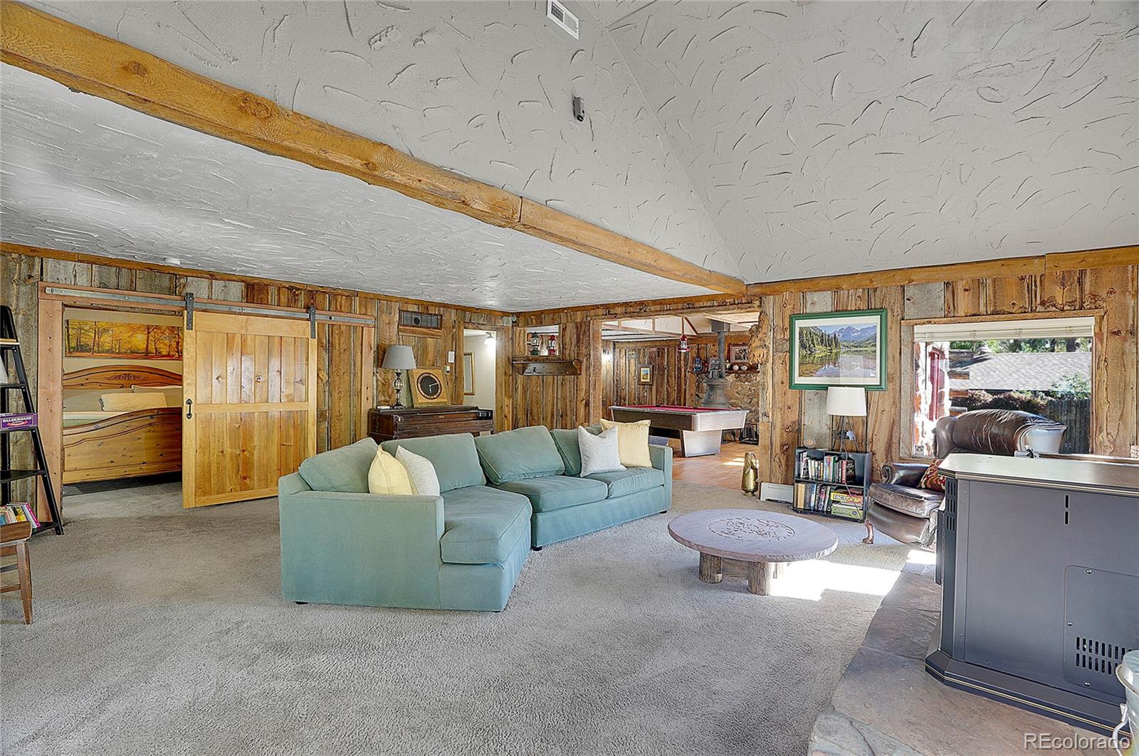 468 Riverside Drive Lyons, CO 80540 - Photo 39 of 50 a living room with furniture and a large window