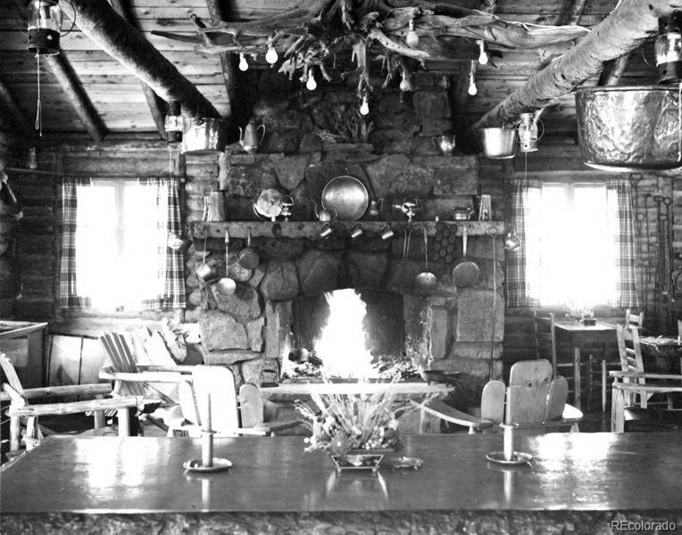 468 Riverside Drive Lyons, CO 80540 - Photo 48 of 50 a living room with lots of furniture and chandelier