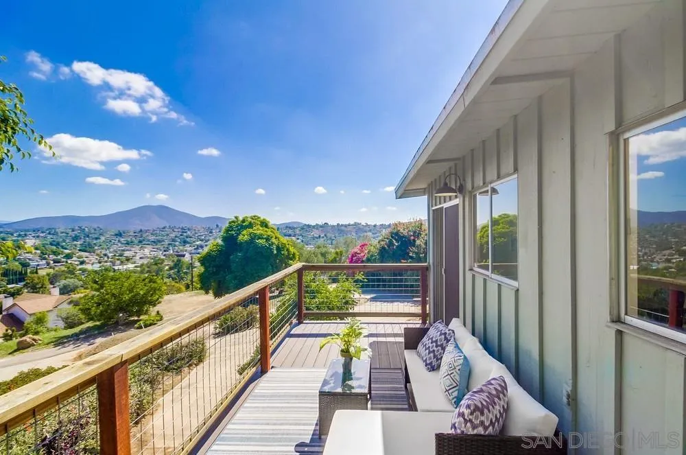 a view of balcony with furniture