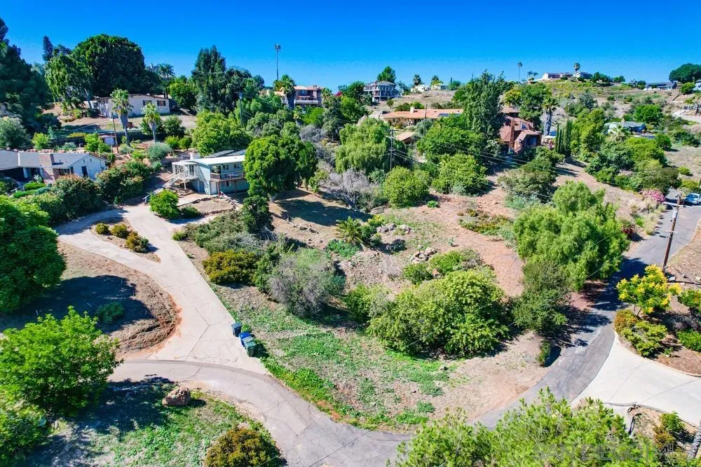 4276 Orchard Drive Spring Valley, CA 91977 - Photo 19 of 19 a view of a garden with a lot of flower plants and wooden fence