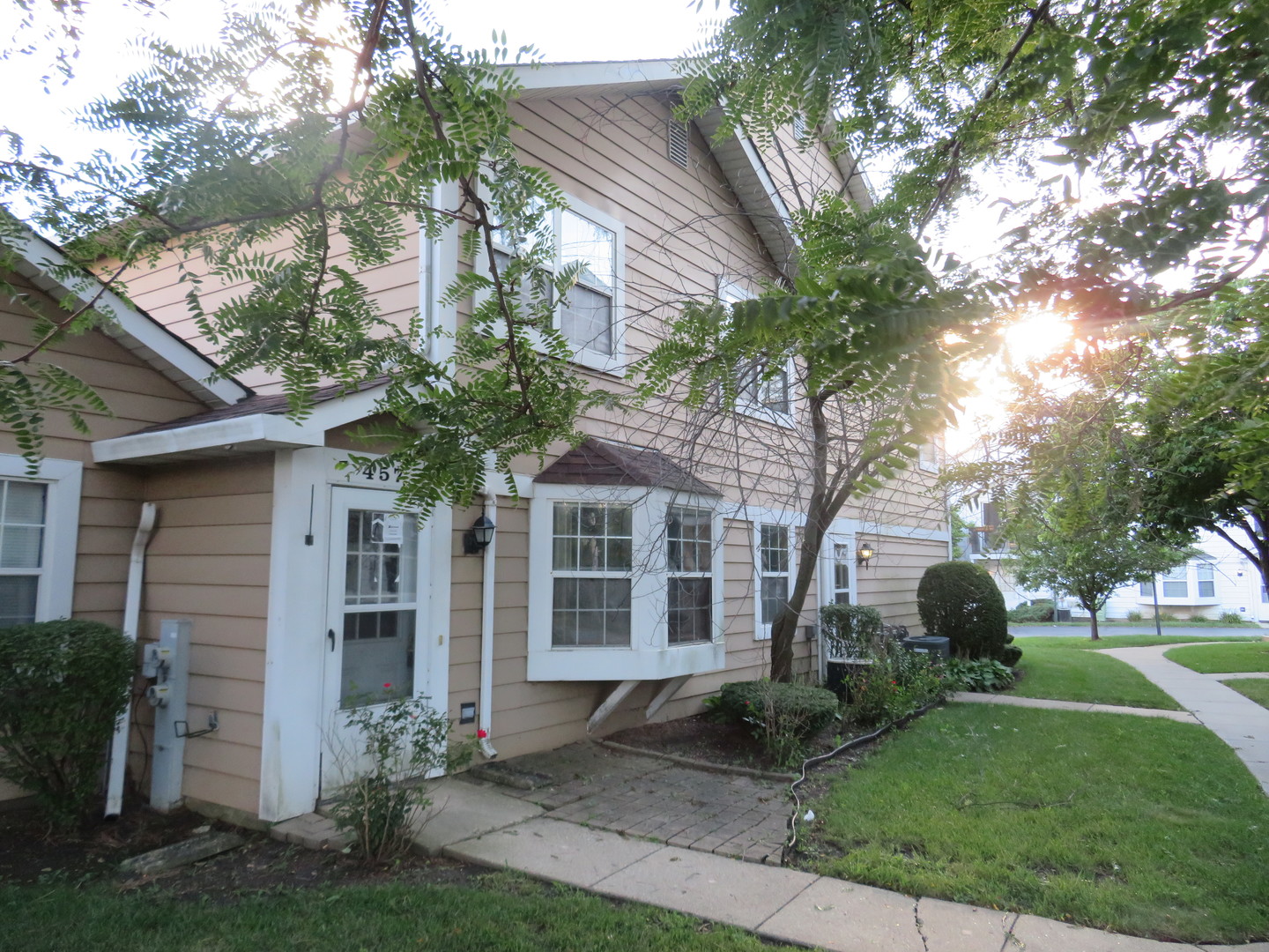 457 North Cambridge Drive, Unit 457 Palatine, IL 60067 - Photo 1 of 31 a front view of a house with garden