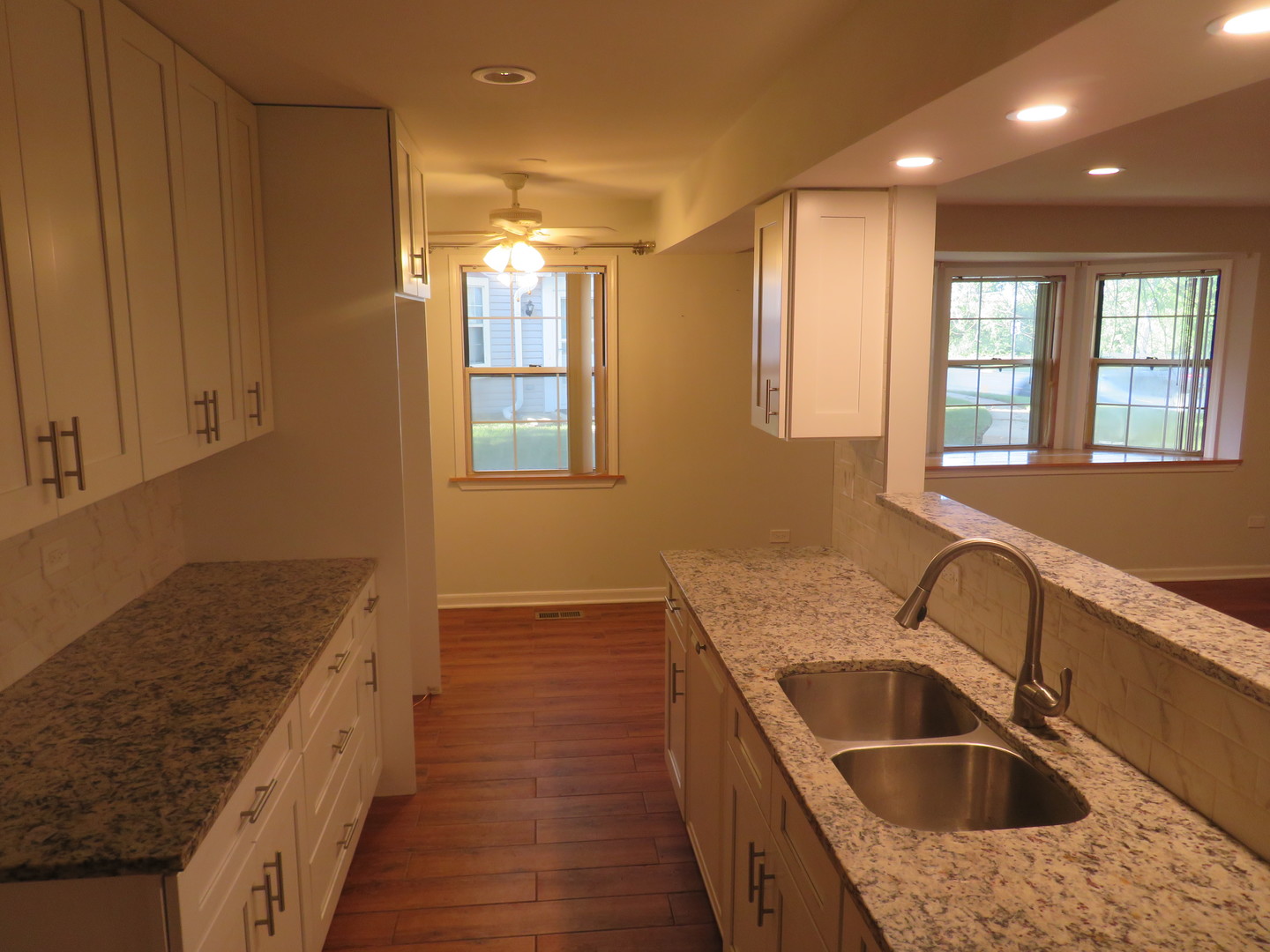 457 North Cambridge Drive, Unit 457 Palatine, IL 60067 - Photo 11 of 31 a kitchen with a sink and a stove top oven