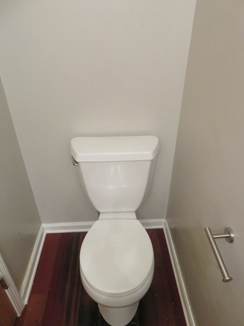 457 North Cambridge Drive, Unit 457 Palatine, IL 60067 - Photo 14 of 31 a bathroom with a toilet and a sink