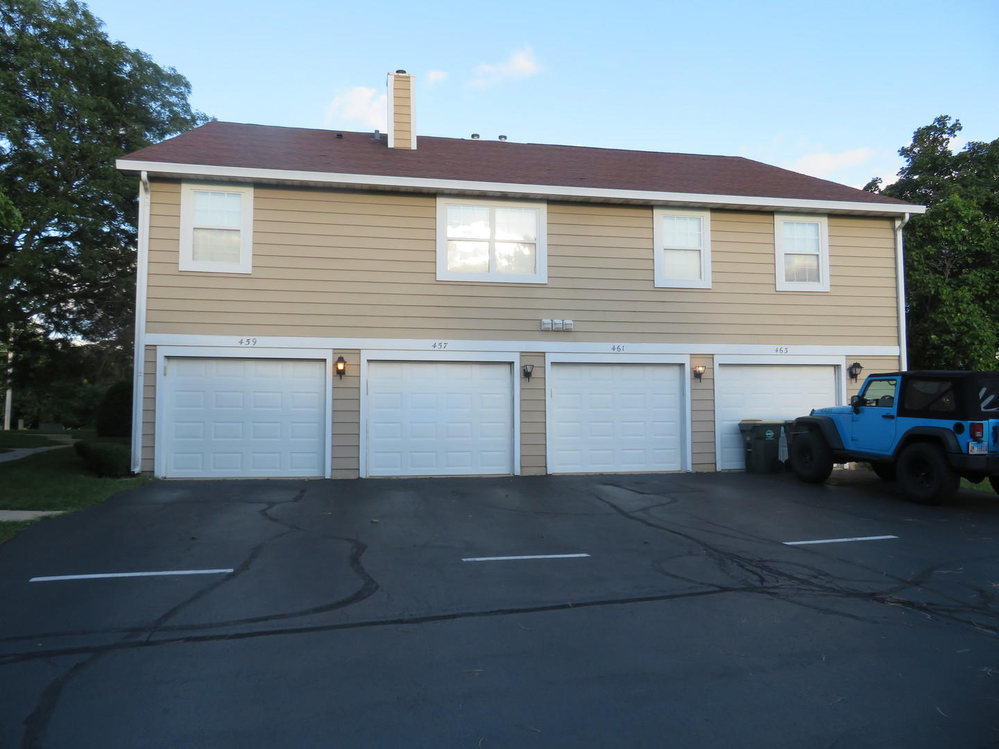 457 North Cambridge Drive, Unit 457 Palatine, IL 60067 - Photo 2 of 31 a view of a house with a parking space