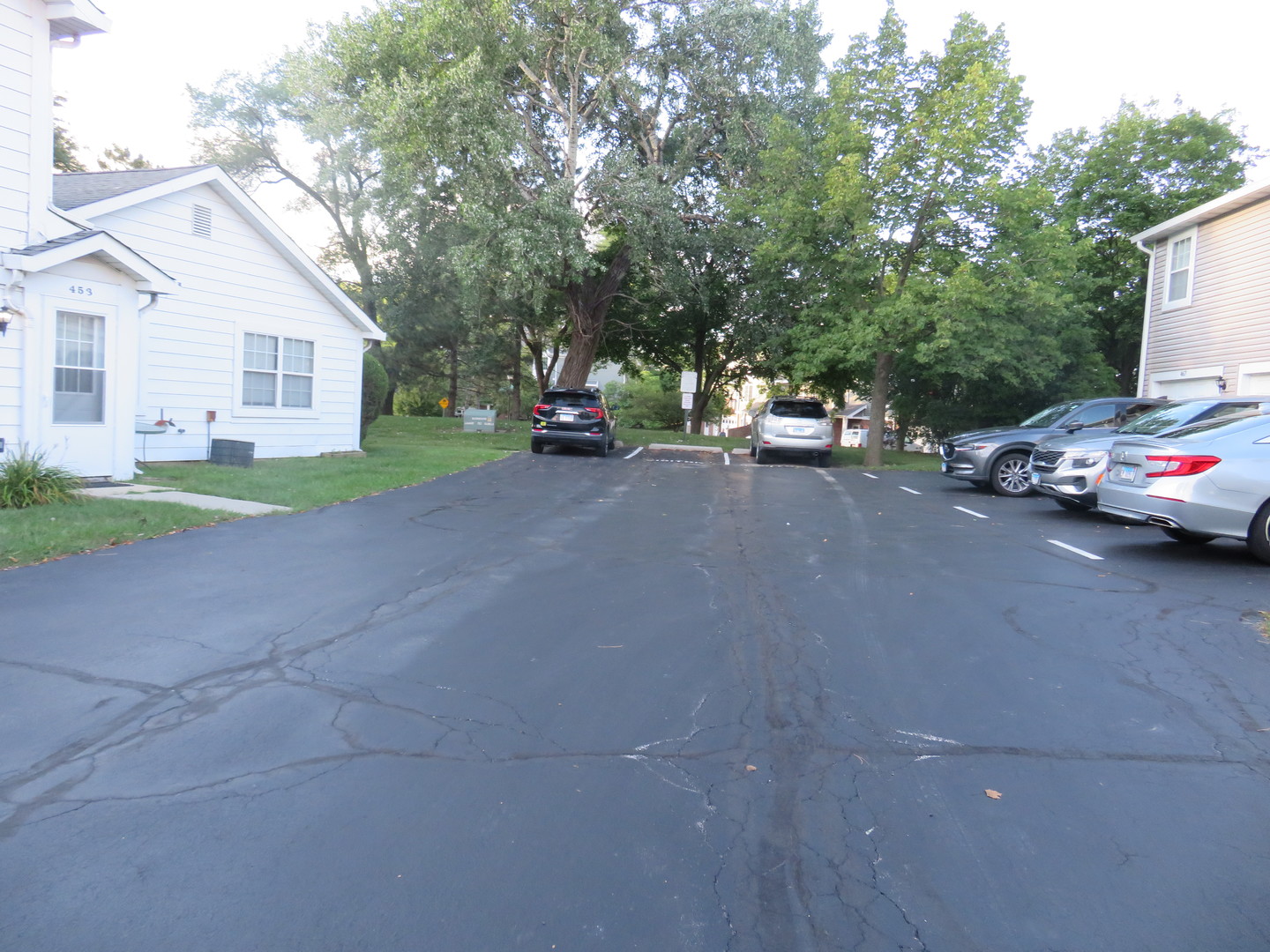 457 North Cambridge Drive, Unit 457 Palatine, IL 60067 - Photo 30 of 31 a view of a car parked in front of a house