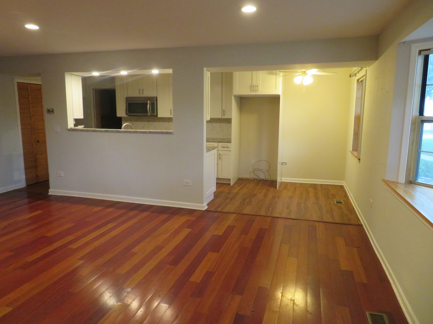 457 North Cambridge Drive, Unit 457 Palatine, IL 60067 - Photo 8 of 31 a view of a room with wooden floor and staircase