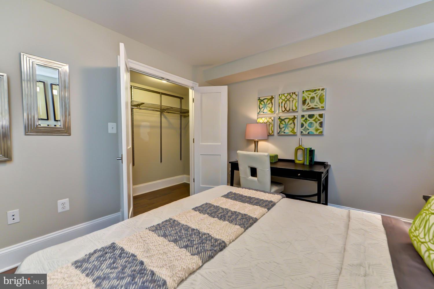 3921 Fulton Street Northwest, Unit 1 Washington, DC 20007 - Photo 14 of 25 a bedroom with a bed and a window