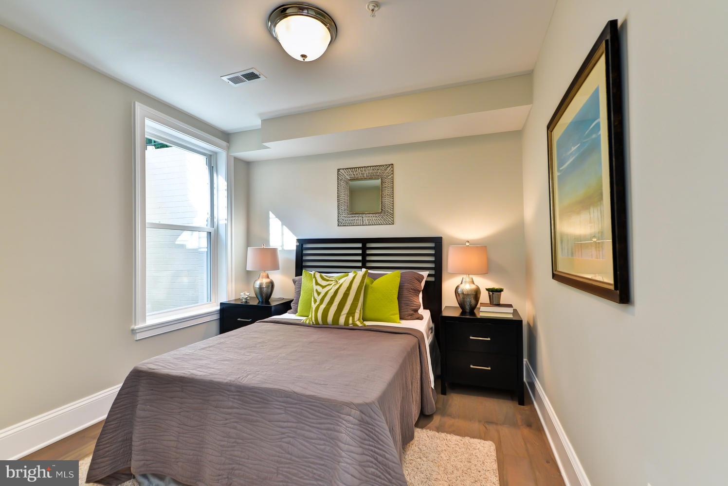 3921 Fulton Street Northwest, Unit 1 Washington, DC 20007 - Photo 18 of 25 a bedroom with a bed and window