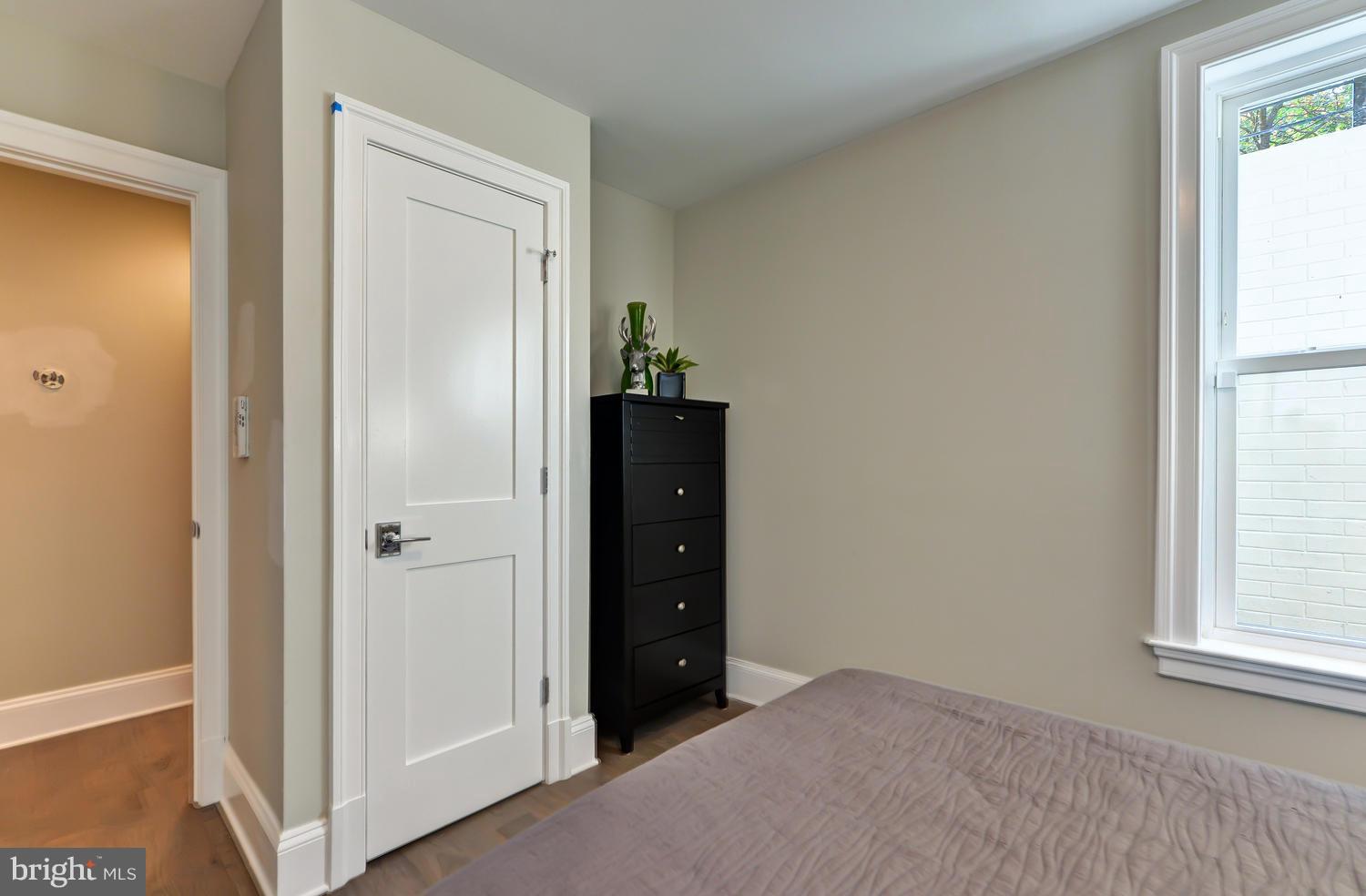 3921 Fulton Street Northwest, Unit 1 Washington, DC 20007 - Photo 19 of 25 an empty room with windows and closet