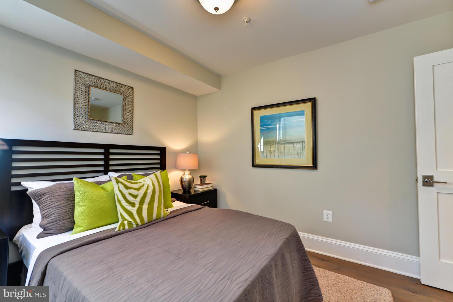 3921 Fulton Street Northwest, Unit 1 Washington, DC 20007 - Photo 20 of 25 a bedroom with a bed and chair