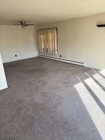 an empty room with staircase