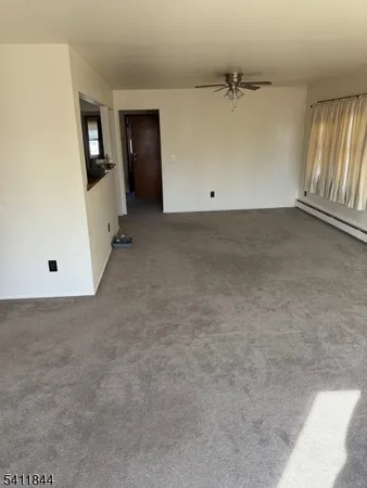 an empty room with staircase