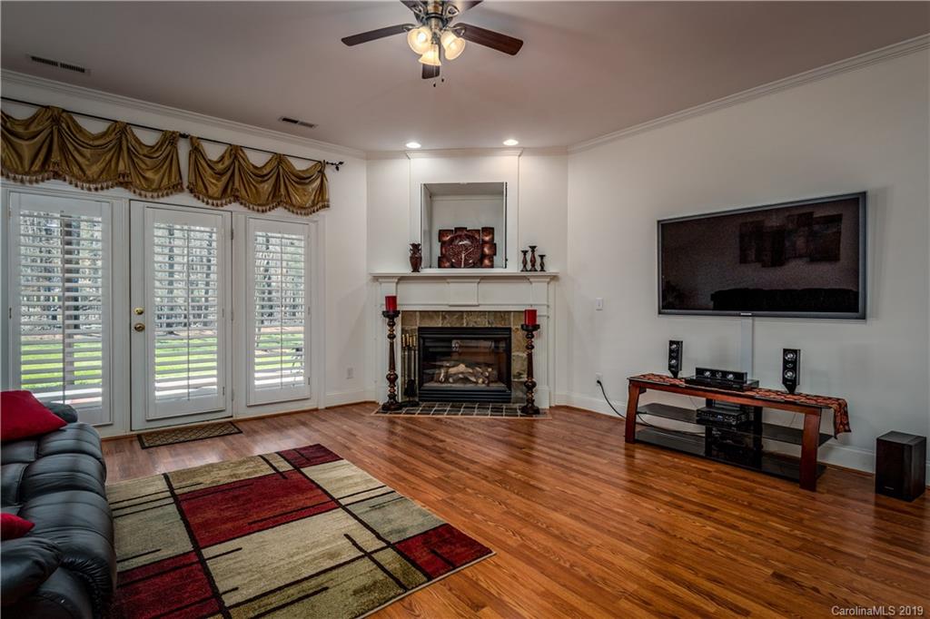 3116 Rhett Butler Place Charlotte, NC 28270 - Photo 11 of 18 a living room with furniture and a flat screen tv