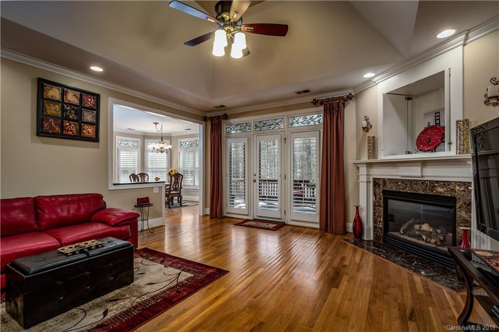 3116 Rhett Butler Place Charlotte, NC 28270 - Photo 5 of 18 a living room with furniture fireplace and flat screen tv