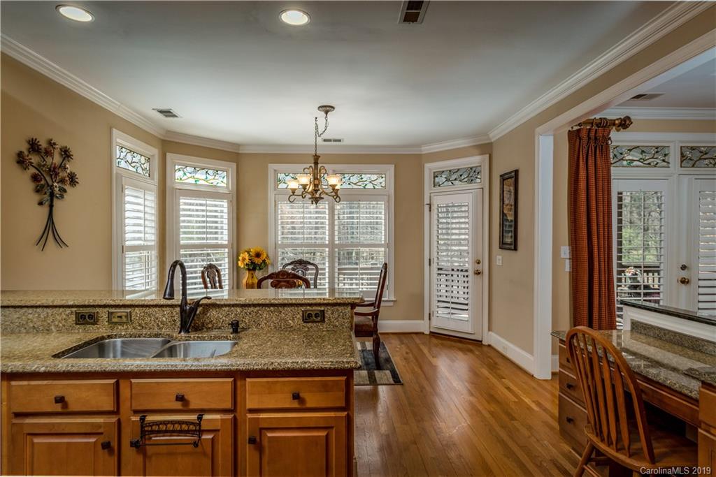 3116 Rhett Butler Place Charlotte, NC 28270 - Photo 6 of 18 a kitchen with counter top space and wooden floor