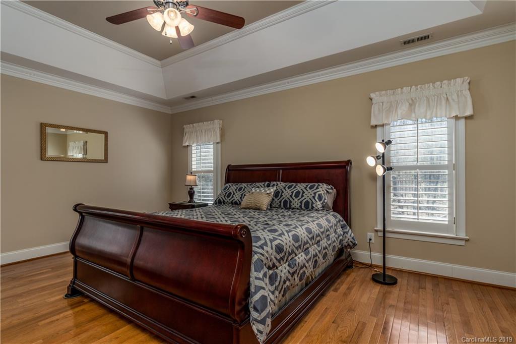 3116 Rhett Butler Place Charlotte, NC 28270 - Photo 8 of 18 a bedroom with a bed and a window