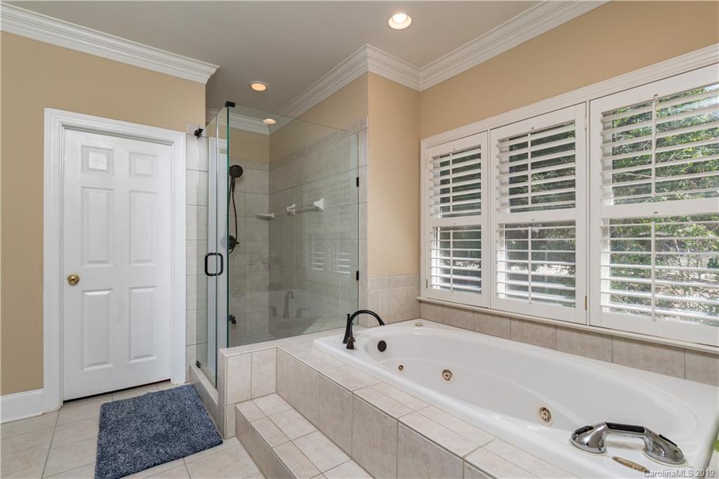 3116 Rhett Butler Place Charlotte, NC 28270 - Photo 10 of 18 a bathroom with a bathtub a shower and a sink