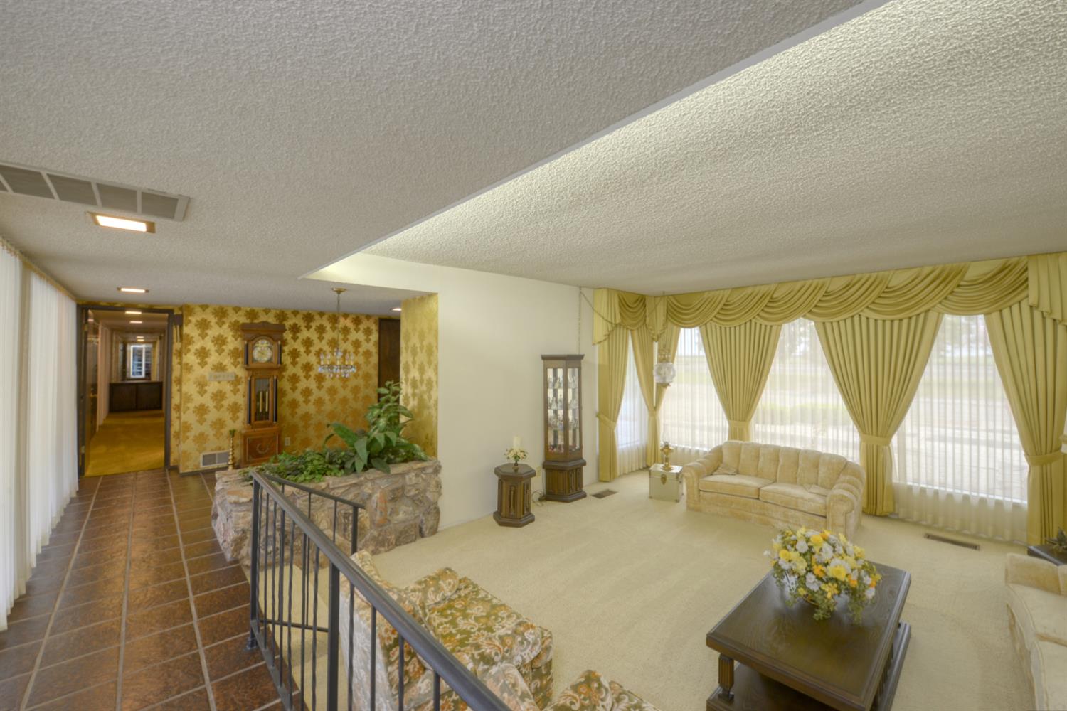 1471 Highway 33 Gustine, CA 95322 - Photo 9 of 57 a bedroom with furniture and large windows