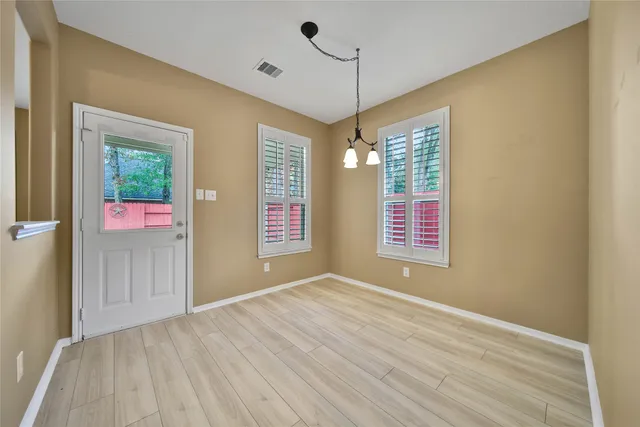 a kitchen with stainless steel appliances granite countertop a sink and a stove
