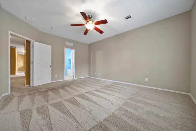 a view of a bathroom from a corridor