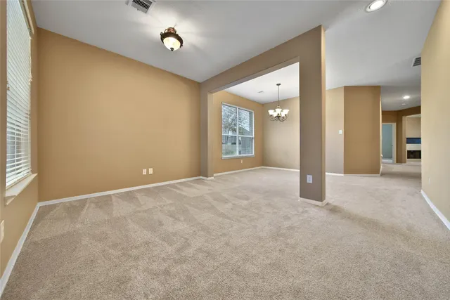 a view of a hallway with a bathroom