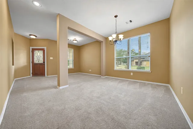 a view of an empty room with a fireplace