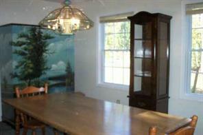 10104 Timberhitch Road Waxhaw, NC 28173 - Photo 5 of 8 a view of a dining room with furniture and chandelier