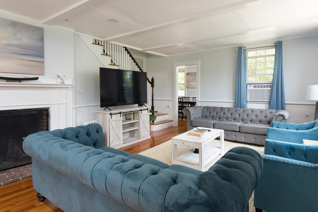 16 Jefferson Shores Road Wareham, MA 02532 - Photo 12 of 37 a living room with furniture and a flat screen tv
