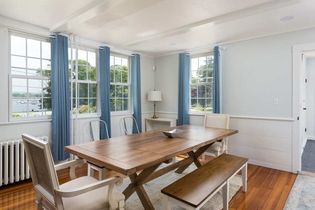 16 Jefferson Shores Road Wareham, MA 02532 - Photo 14 of 37 a view of a dining room with furniture window and wooden floor
