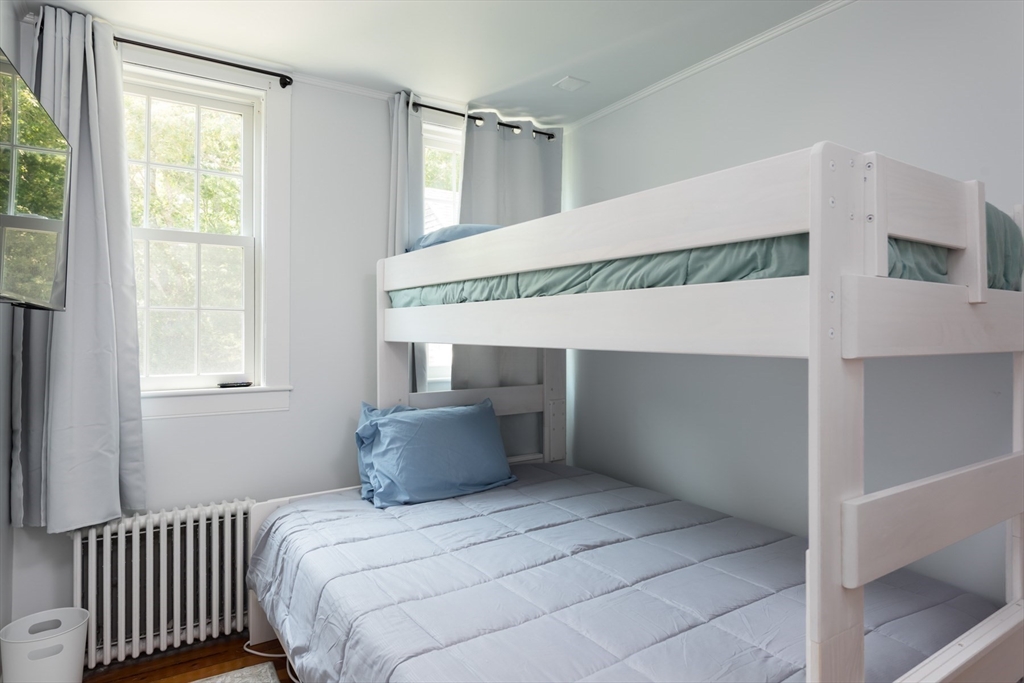 16 Jefferson Shores Road Wareham, MA 02532 - Photo 25 of 37 a bedroom with a bed and window