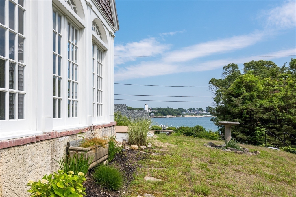 16 Jefferson Shores Road Wareham, MA 02532 - Photo 7 of 37 a view of a building in the backyard