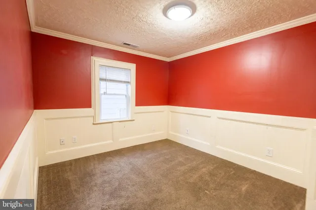 a open kitchen with kitchen island a sink dishwasher a refrigerator and wooden cabinets