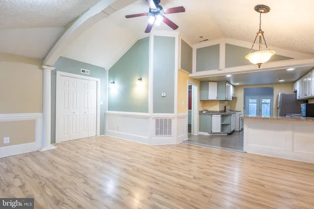 a kitchen with stainless steel appliances a stove a sink and a refrigerator