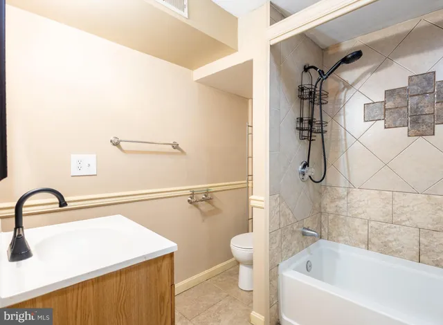 a bathroom with a sink and mirror
