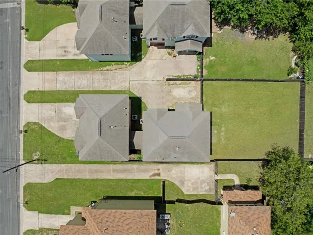 an aerial view of residential house with outdoor space