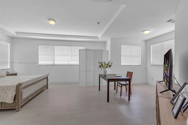 a bedroom with a bed and a table in it