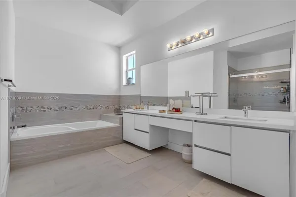 a white toilet sitting next to a bathroom sink