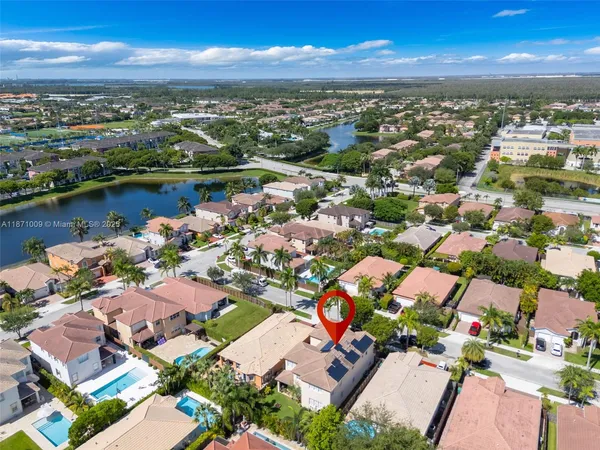 an aerial view of city and lake