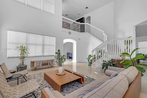 a living room with furniture and a table