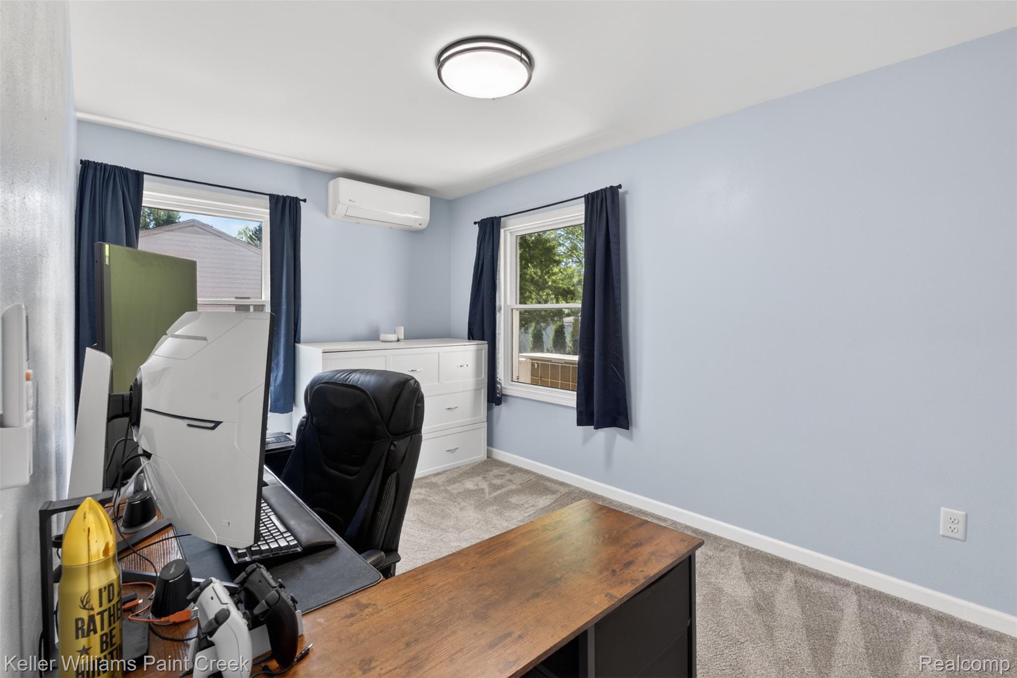 2942 Tatham Road Saginaw, MI 48601 - Photo 18 of 59 Office area with light colored carpet and a wall mounted mini split