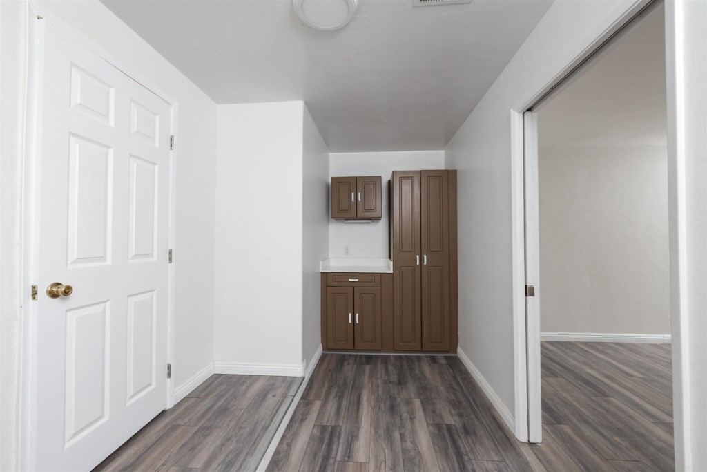 2513 Sarbonne Drive Oceanside, CA 92054 - Photo 14 of 55 a view of a hallway with wooden floor and closet