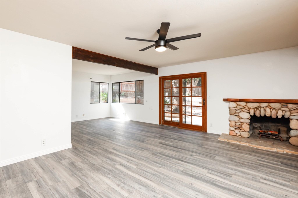 2513 Sarbonne Drive Oceanside, CA 92054 - Photo 18 of 55 a view of an empty room with window and wooden floor