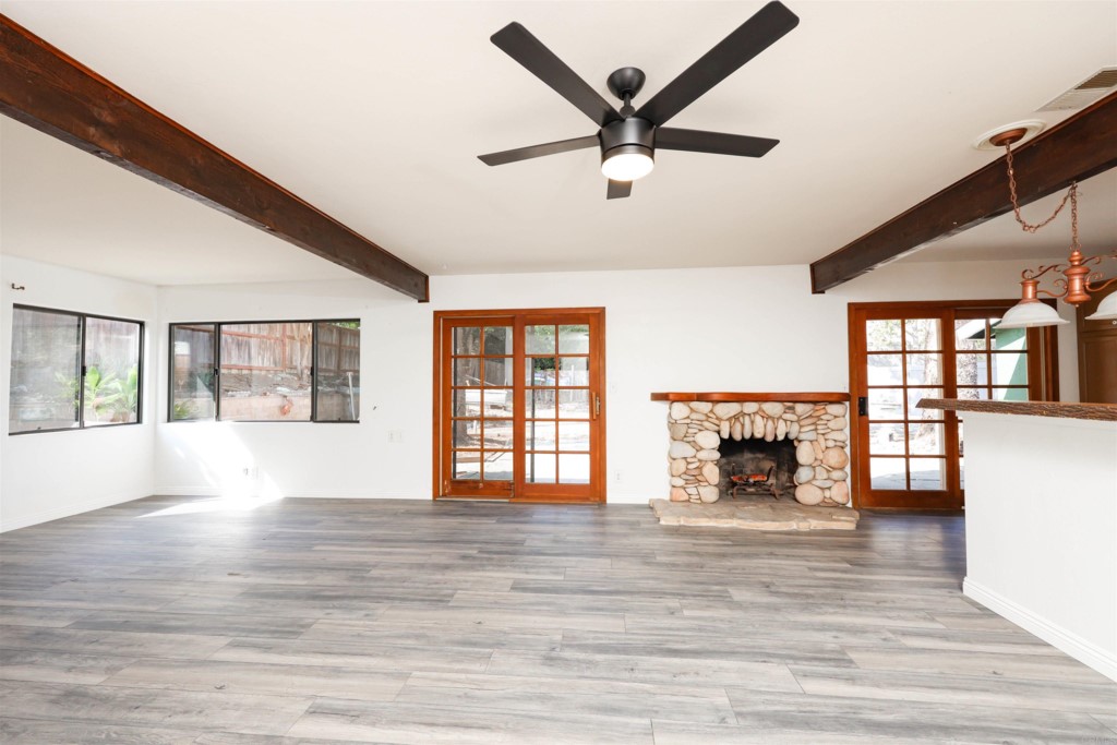 2513 Sarbonne Drive Oceanside, CA 92054 - Photo 19 of 55 a living room with furniture and a fireplace