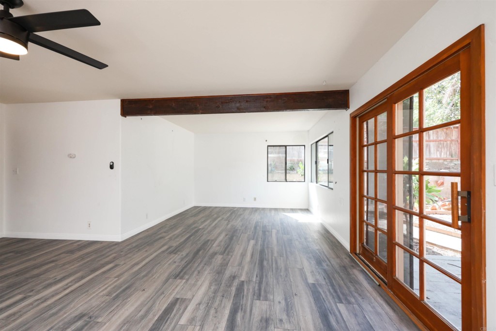 2513 Sarbonne Drive Oceanside, CA 92054 - Photo 20 of 55 a view of an empty room with wooden floor and a window