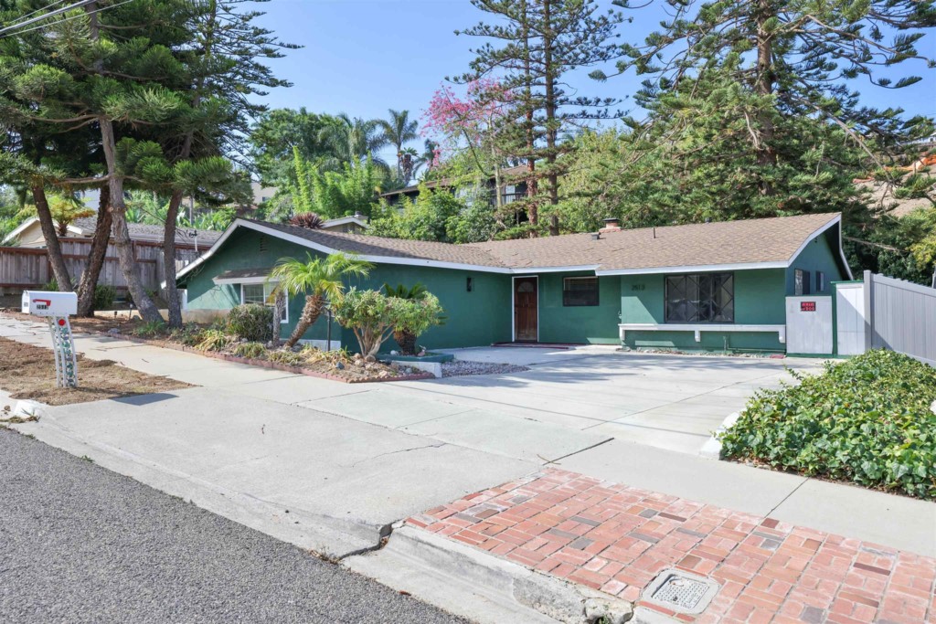 2513 Sarbonne Drive Oceanside, CA 92054 - Photo 2 of 55 front view of a house with a yard