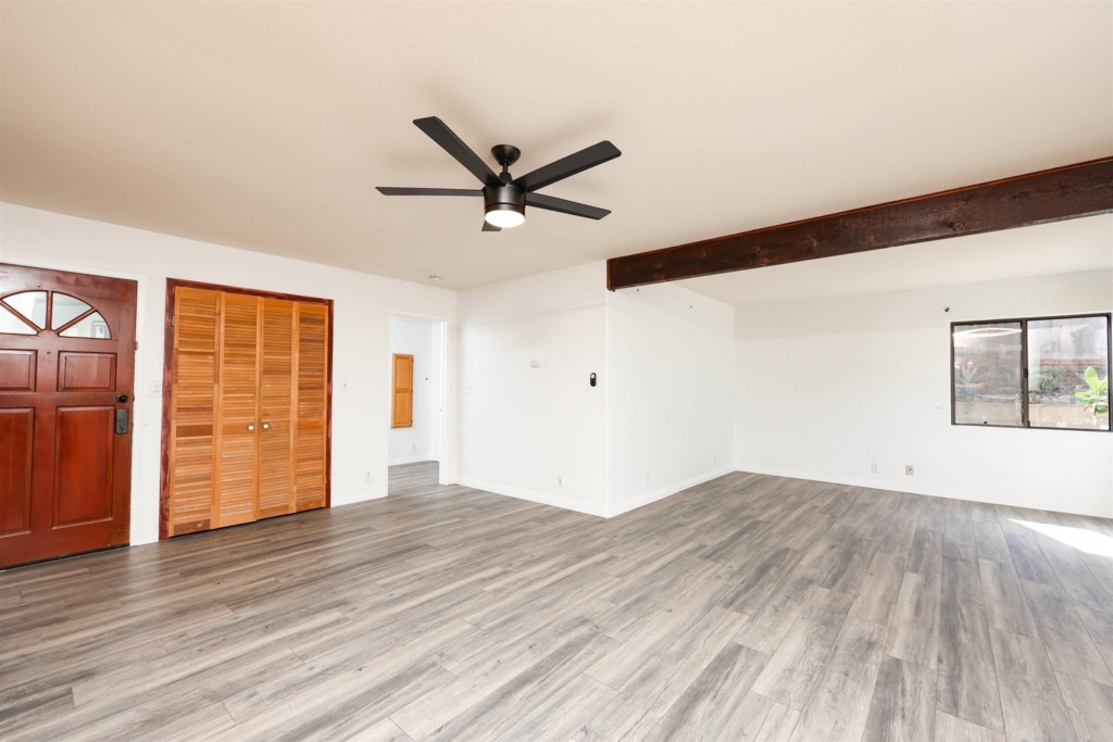 2513 Sarbonne Drive Oceanside, CA 92054 - Photo 25 of 55 an empty room with wooden floor and windows
