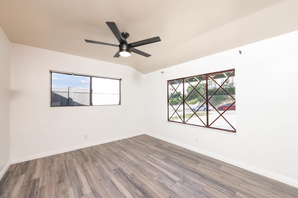 2513 Sarbonne Drive Oceanside, CA 92054 - Photo 33 of 55 a view of empty room with wooden floor and fan